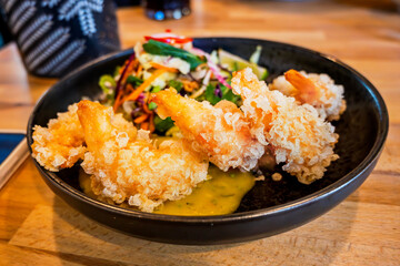 Fried tempura shrimp with salad. - 736427717