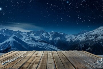 Empty wooden deck table against view of snowy mountain range in the night. With space for the product