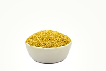 Yellow Moong Dal or Green Gram Beans in a White Bowl Isolated on White Background with Copy Space