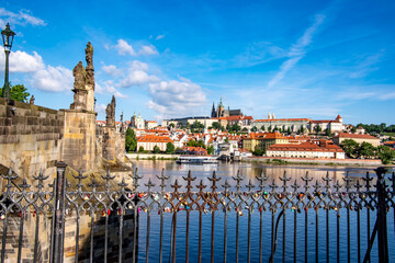 Charles bridge on a sunny day in Prague - obrazy, fototapety, plakaty