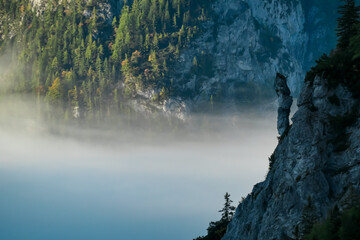 Unique rock formation overlooking fog covered valley in untamed Hochschwab mountain region, Styria,...
