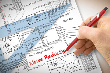 Engineer writing formulas about noise reduction in buildings - concept image