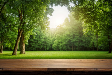 blurred green leaves and tree background with wooden table for product.