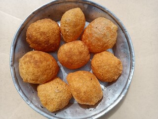 cookies on a plate Pani Puri, Golgappe, Chat item, India dry Puri use full for Pani Puri Panipuri or Golgappa is a common street snack from India. It's a round, hollow puri filled with a mixture 