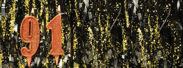 Burning red birthday candles on glitter tinsel background, number 91. Banner.