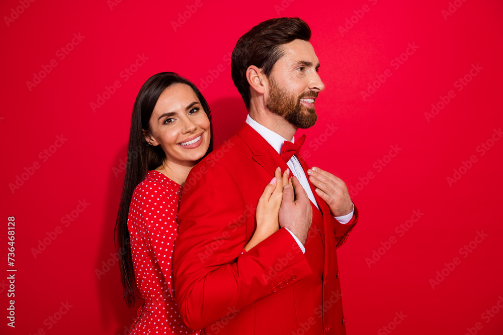 Poster profile portrait of two lovely partners embrace touch hands look empty space isolated on red color b