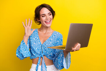 Portrait of cheerful nice girl with short hairstyle wear blue blouse look at laptop waving palm say...