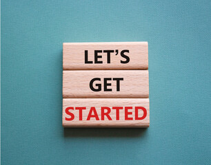 Lets get started symbol. Concept words Lets get started on wooden blocks. Beautiful grey green...