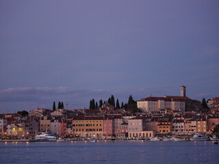 Obraz premium View of the embankment of Rovinj from the sea. The ships are in the harbor