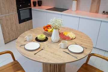 Breakfast in the kitchen. Eating. Dinner in the kitchen.