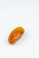 Close-up of dates against a white background. Ramadan concept.