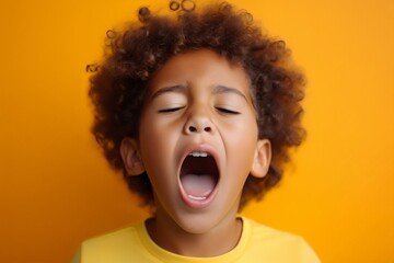 listening to a song artist, black curly haired boy in t shirt screaming and crying or very emotional expression sings songs on audition with opened mouth and closed eyes against orange color wall - obrazy, fototapety, plakaty