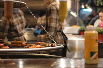 Chef at a large barbecue, skillfully grilling and preparing delicious food