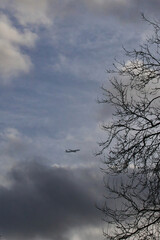 Silhouette of an airplane flying in the sky