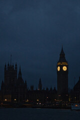 Big Ben at night, viewed from the Thames River