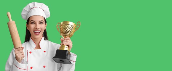 Female chef with trophy cup and rolling pin on green background with space for text