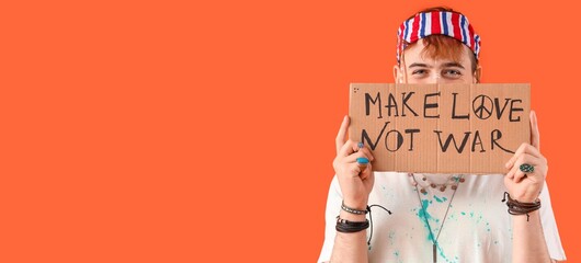 Male hippie holding placard with text MAKE LOVE NOT WAR on orange background with space for text - obrazy, fototapety, plakaty