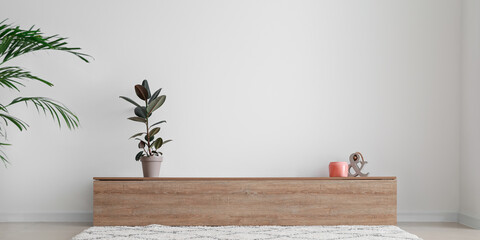 Interior of stylish room with modern TV stand near light wall