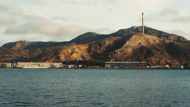 Industrial port in Cartagena, Spain. Cranes and heavy equipment.