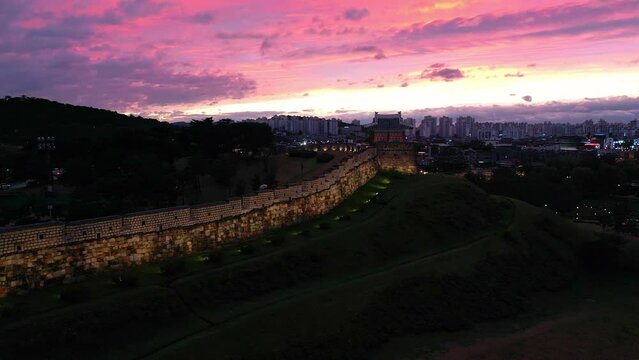 Drone view, Hwaseong Fortress during dusk and sunset sky, South Korea