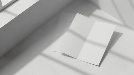 A crisp and pristine blank trifold leaflet mockup is showcased on a bright, minimalist surface, highlighting its ample design space and premium paper quality. Ideal for showcasing design con