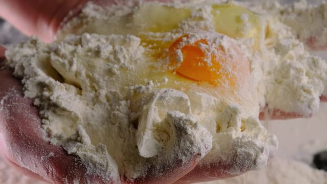 Mix egg and flour, close-up. The process of preparing dough.