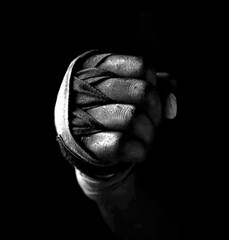 Halftone pattern boxer bandaged fist black background