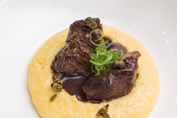 Delicious baked veal cheeks on a plate