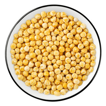 Top view of yellow chickpeas in a bowl isolated on white