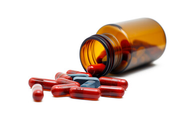 Medicine bottle with capsules spilled out