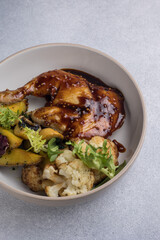 Delicious roast duck leg on a plate