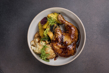Delicious roast duck leg on a plate