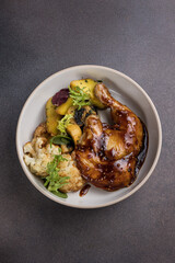 Delicious roast duck leg on a plate