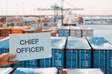 Banner Poster Paper With The Phrase Chief Officer With A Logistics Terminal In The Background