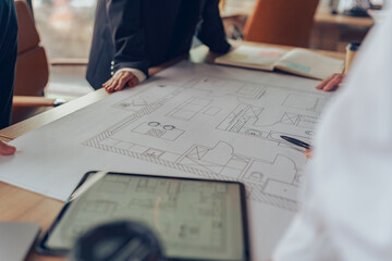 Close up of professional team design engineers working with project documents in modern office 
