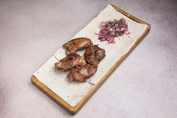 a delicious meat dish of Asian cuisine in a restaurant or pub. Close-ups