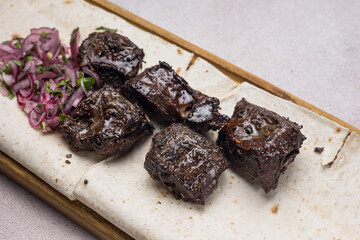 a delicious meat dish of Asian cuisine in a restaurant or pub. Close-ups