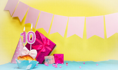 Date of birth with cake and number  10. Colorful card happy birthday for a girl. Copy space....