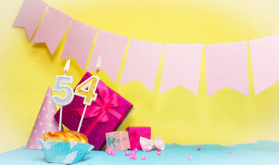 Date of birth with cake and number  54. Colorful card happy birthday for a girl. Copy space....