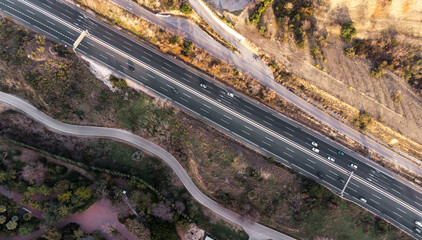 Aerial. cars driving by the highway road. Top view.