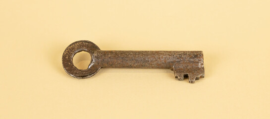 A rusty old key. an old key to an old lock.