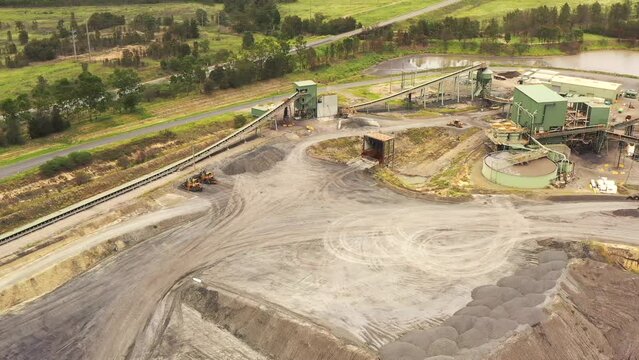 Deep open pit black coal mine excavation in Hunter valley of Australia – aerial 4k.

