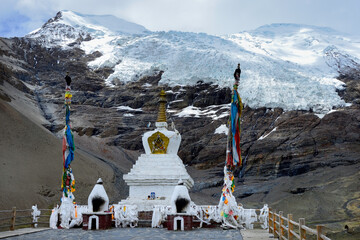 At an altitude of over 16,000' on Karo-La Pass in the Himalayan mountains, sits a Buddhist stupa in front of the Karo-La Glacier.