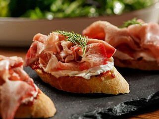 Sandwiches with chopped bacon and rosemary. Shallow depth of field