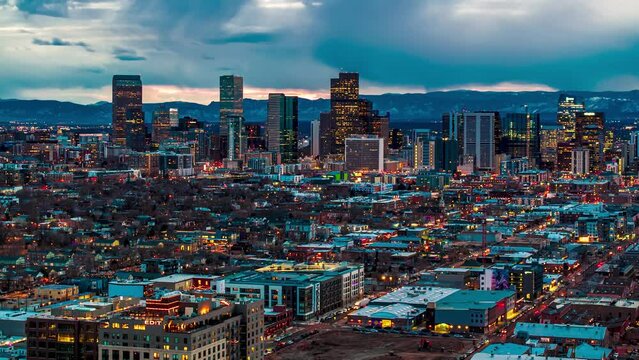 Downtown skyline at dusk hours with city lights, sunset, drone hyperlapse, Denver, Colorado, 4K