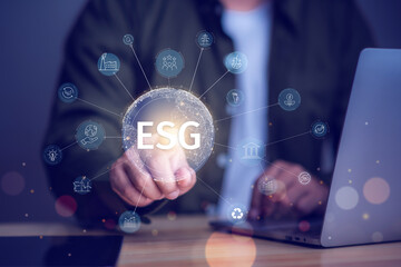 ESG sustainable investment concept, investor touching environmental social governance( ESG) icon on virtual hologram, sustainability, investing.sustainability, investing.