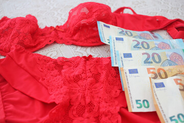 red lingerie and euro bills