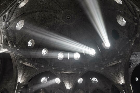 Beams of light illuminate the interior of St Jacob's Church, Enschede, Netherlands