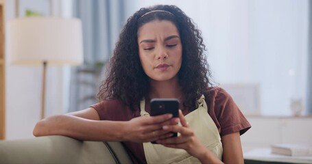 Woman, sofa and frustrated for message on cellphone, stress and online scam on weekend in house. Mexican lady, smartphone and worry for notification on social media, mobile app and web chat in home - Powered by Adobe