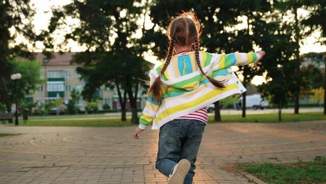little girl running through park sunset, happy family, running foot along road kid girl daughter, overcoming oneself, strengthens heart muscle, compete over long distances, breathing, little daughter
